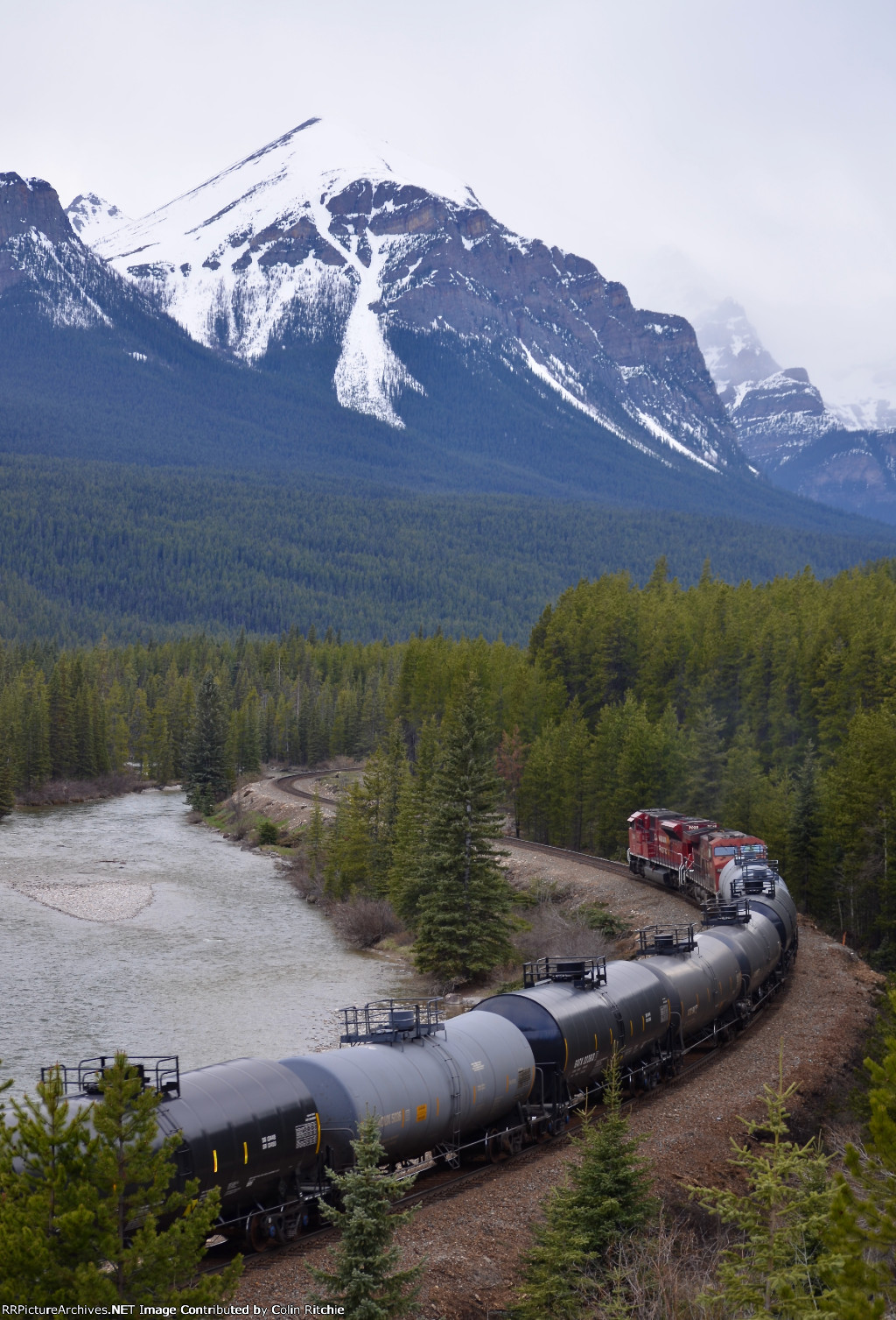 CP 7029/8557 leading a W/B unit tank car train through Morant's Curve, alongside the Bow River in Banff National Park.